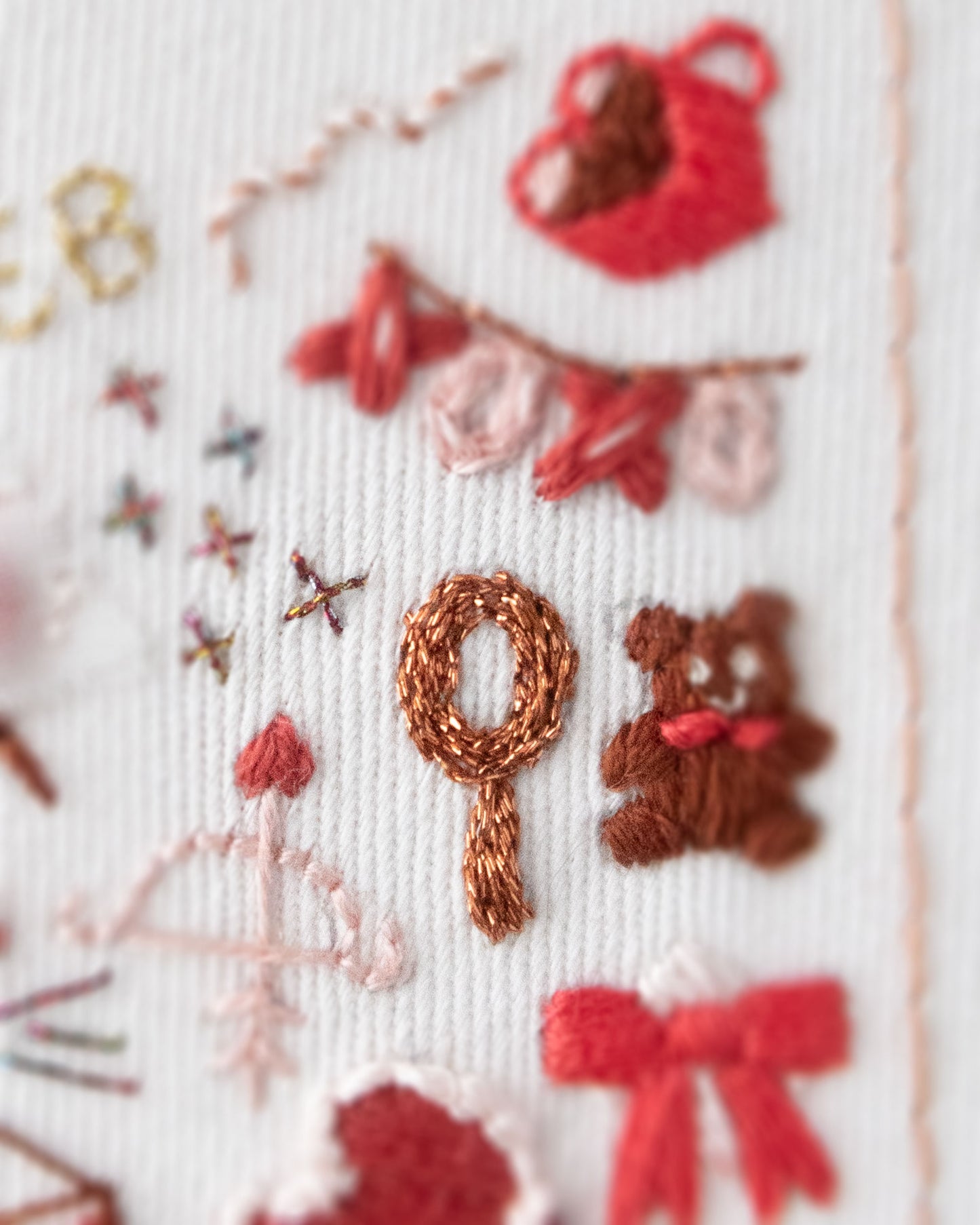 Embroidery Journal - Add On Icons, Basic Shapes close up detail of red shapes showing stitching used