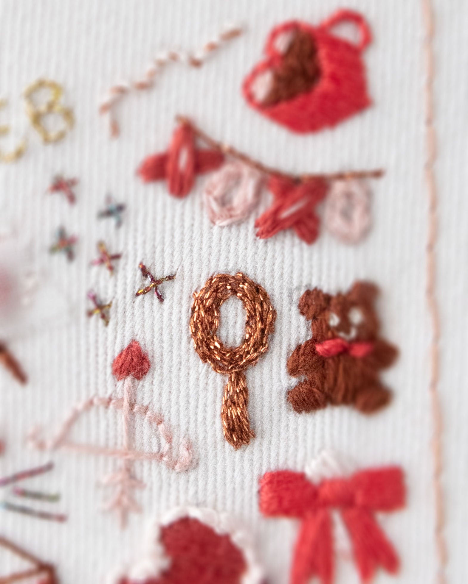 Embroidery Journal - Add On Icons, Basic Shapes close up detail of red shapes showing stitching used