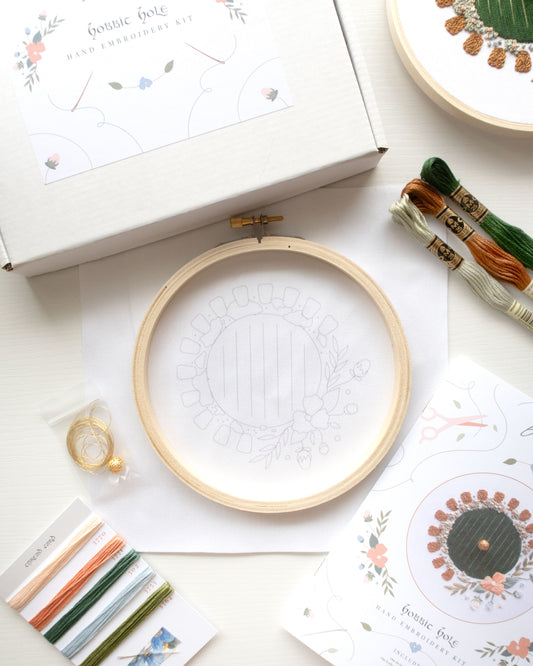 Hobbit Hole Embroidery Kit beginning kit contents laid out on white background
