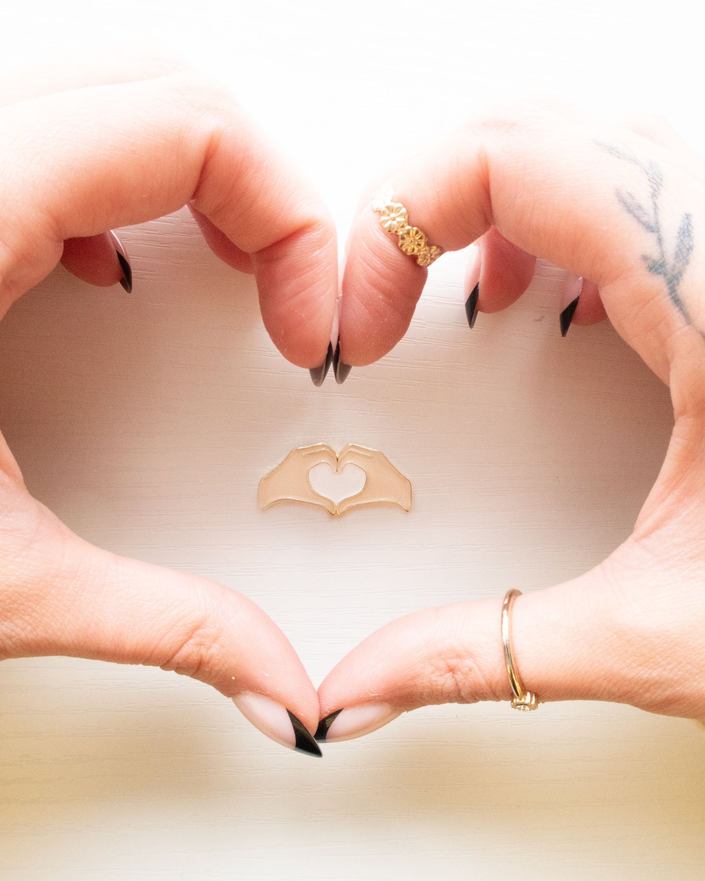Heart Hands Embroidery Needle Minder framed by real heart hands