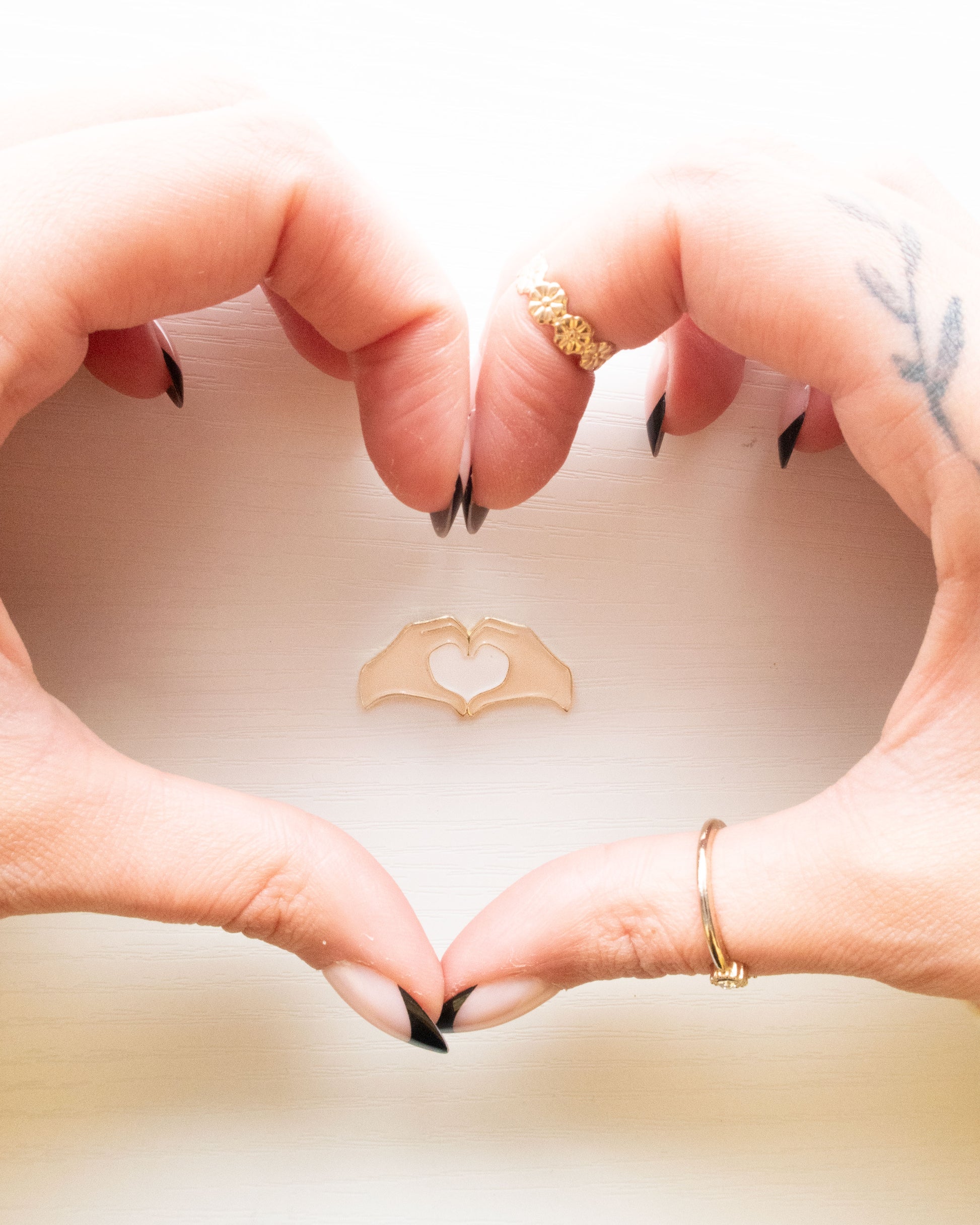 Heart Hands Embroidery Needle Minder framed by real heart hands