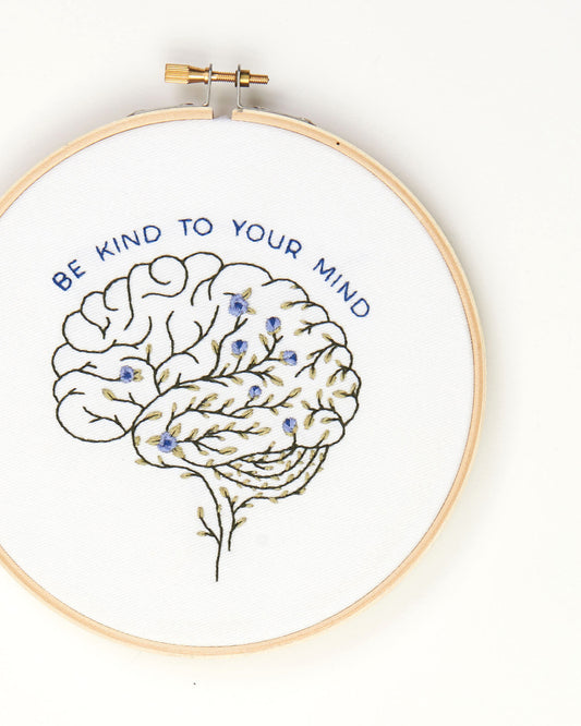 Be Kind To Your Mind Floral Brain Embroidery Kit finished on white background