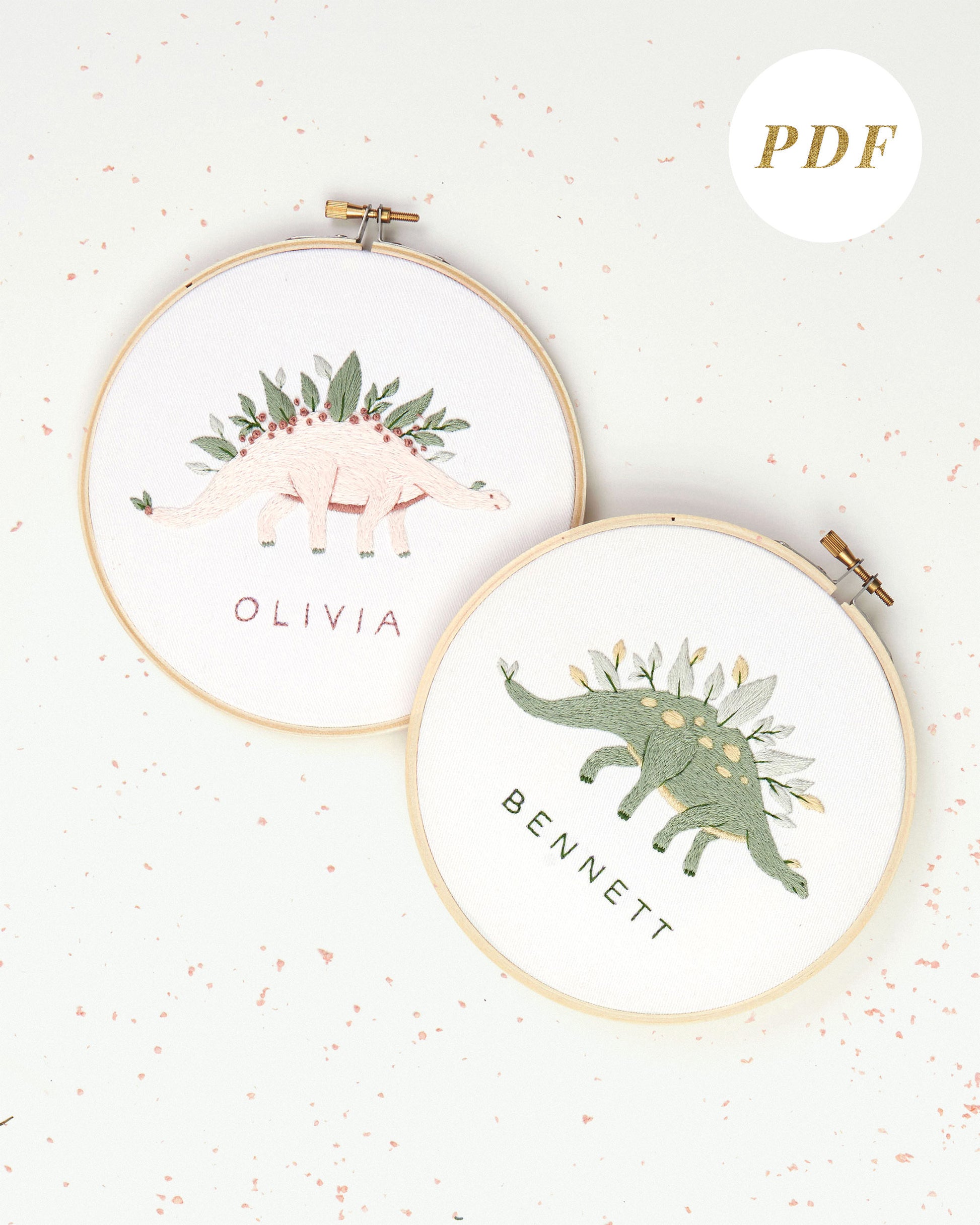 Green and pink dinosaur embroidery with leaves and flowers and custom baby name embroidery pattern