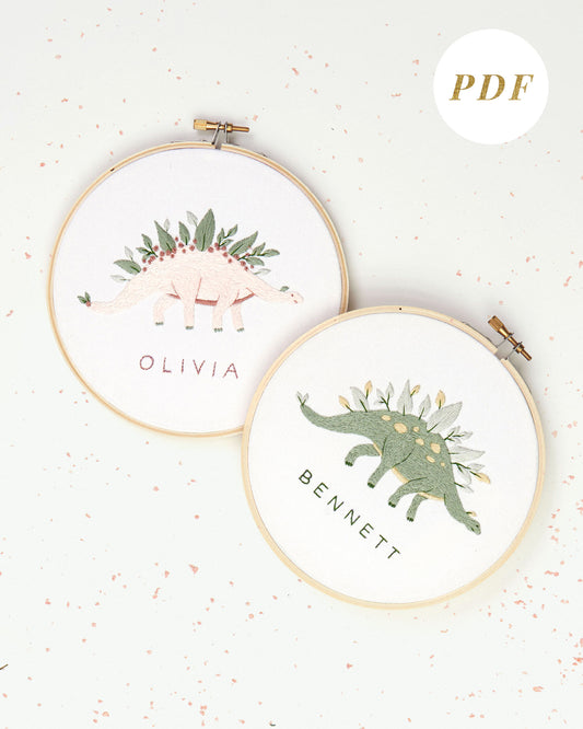 Green and pink dinosaur embroidery with leaves and flowers and custom baby name embroidery pattern