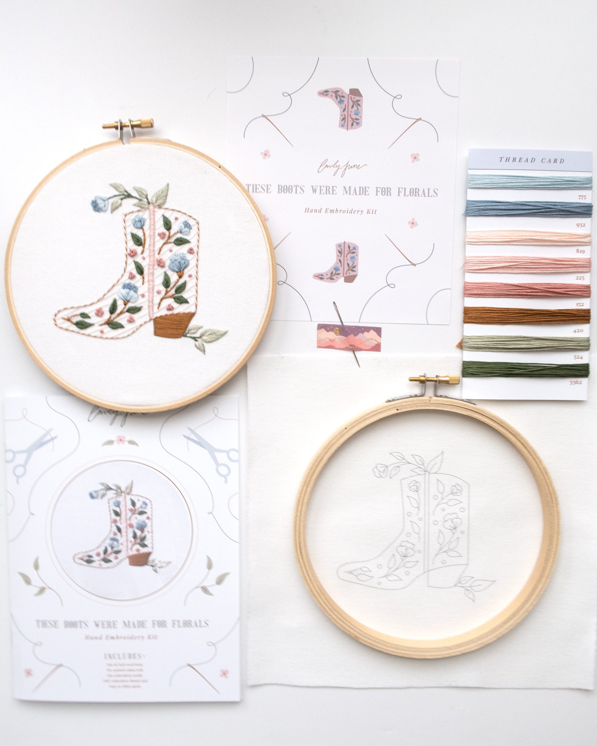 Floral cowboy boot hand embroidery kit with pink and blue flowers and light green leaves with embroidery floss, wood embroidery hoop, printed embroidery fabric, embroidery guide, and embroidery needle