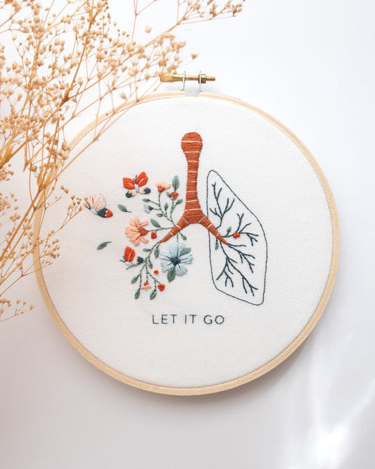 Let it go floral lung hand embroidery kit with pink and blue flowers and butterflies for mental health craft