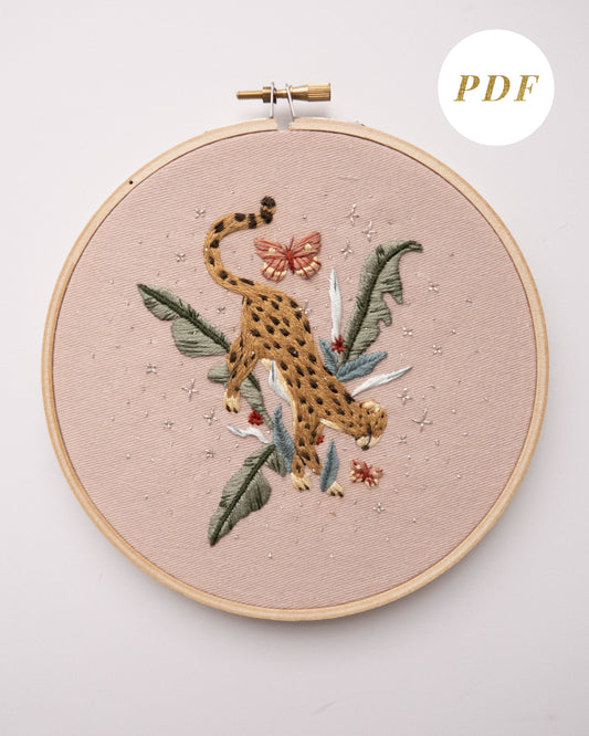 Cheetah in jungle hand embroidery pattern on light pink fabric, green jungle leaves, pink butterflies and silver stars