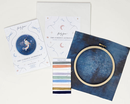 Blush astronaut in outer space hand embroidery kit for outer space nursery or decor with planets and stars with printed embroidery fabric, wood embroidery hoop, embroidery floss, embroidery needle and embroidery guide