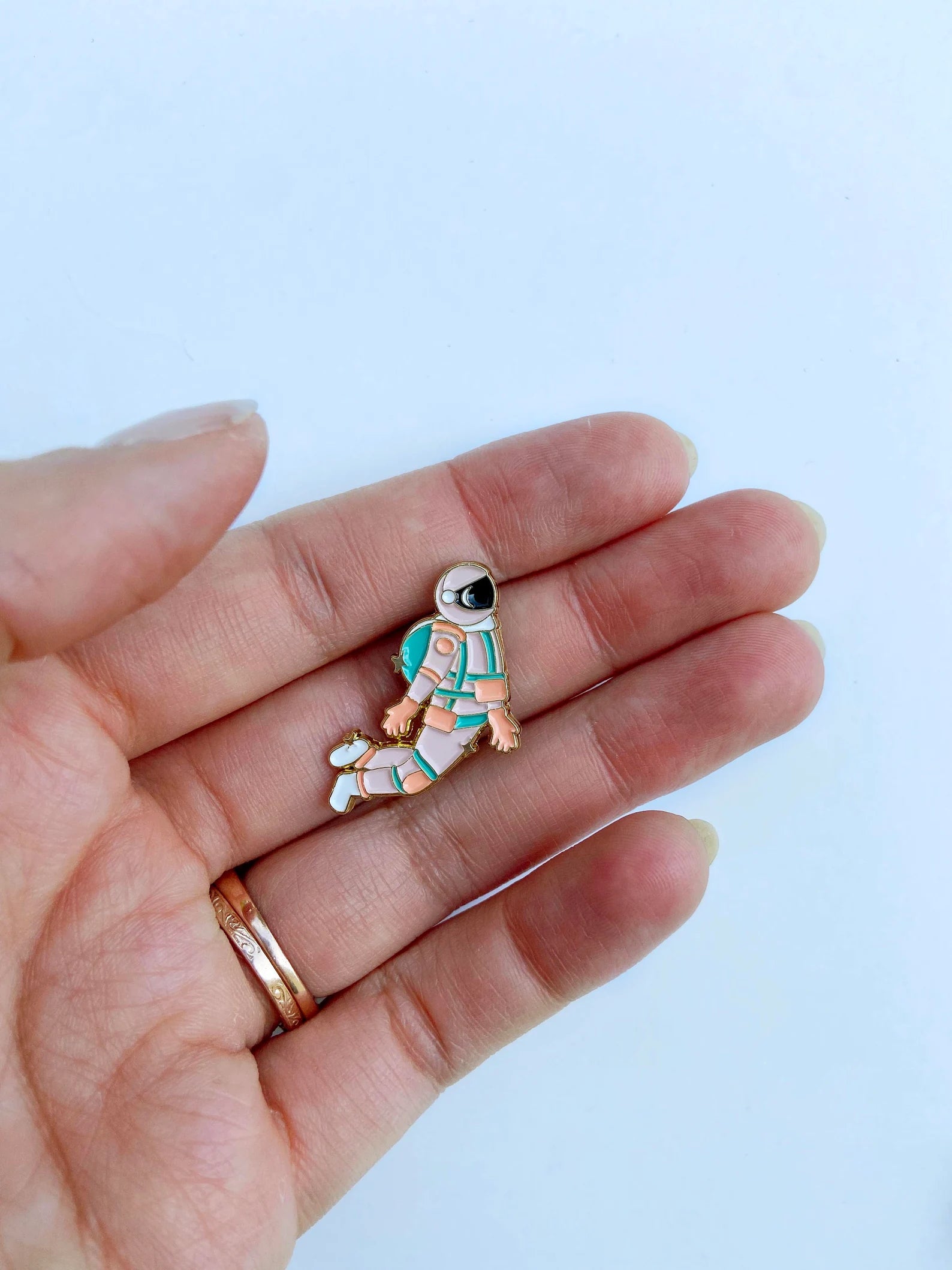 Pink and gold astronaut enamel needle minder or needle nanny with embroidery needle for hand embroidery hoop