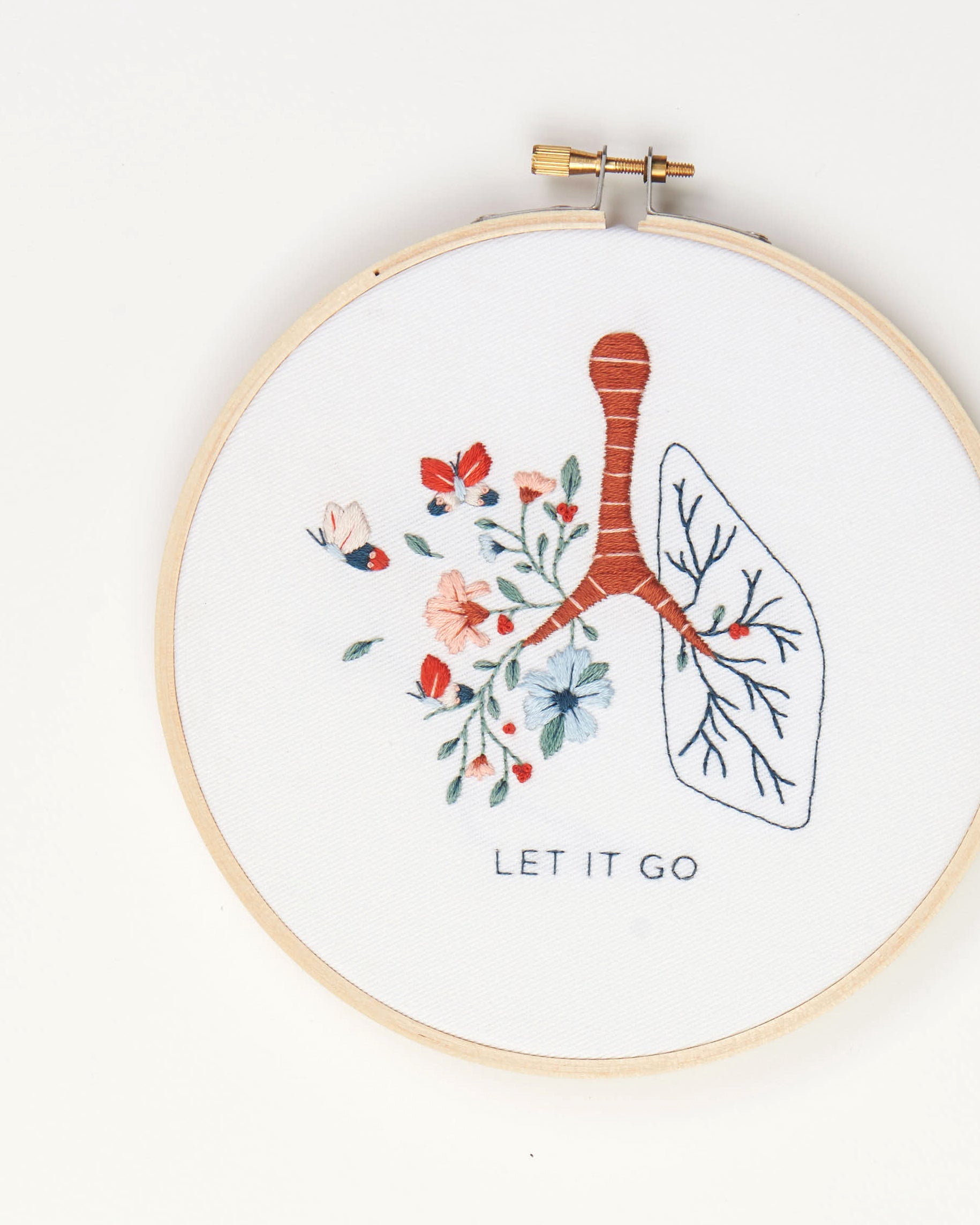 Let it go floral lung hand embroidery kit with pink and blue flowers and butterflies for mental health craft