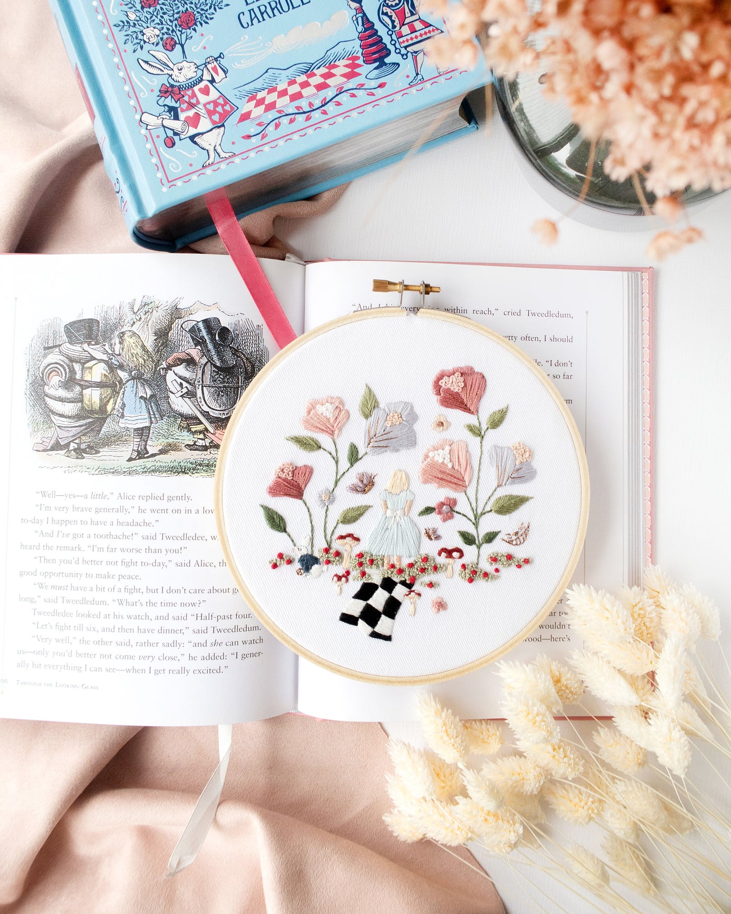 Alice in Wonderland Embroidery on open book with flowers