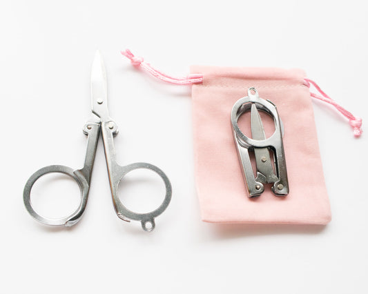 4 Inch Folding Travel Embroidery Scissors with pink velvet pouch straight on view