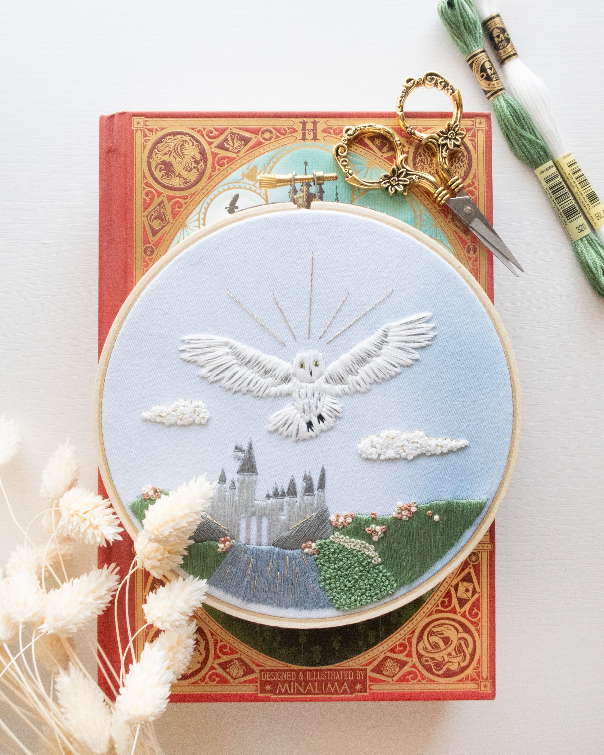 Spring Magical Owl Embroidery Kit on a book with flowers and floral scissors