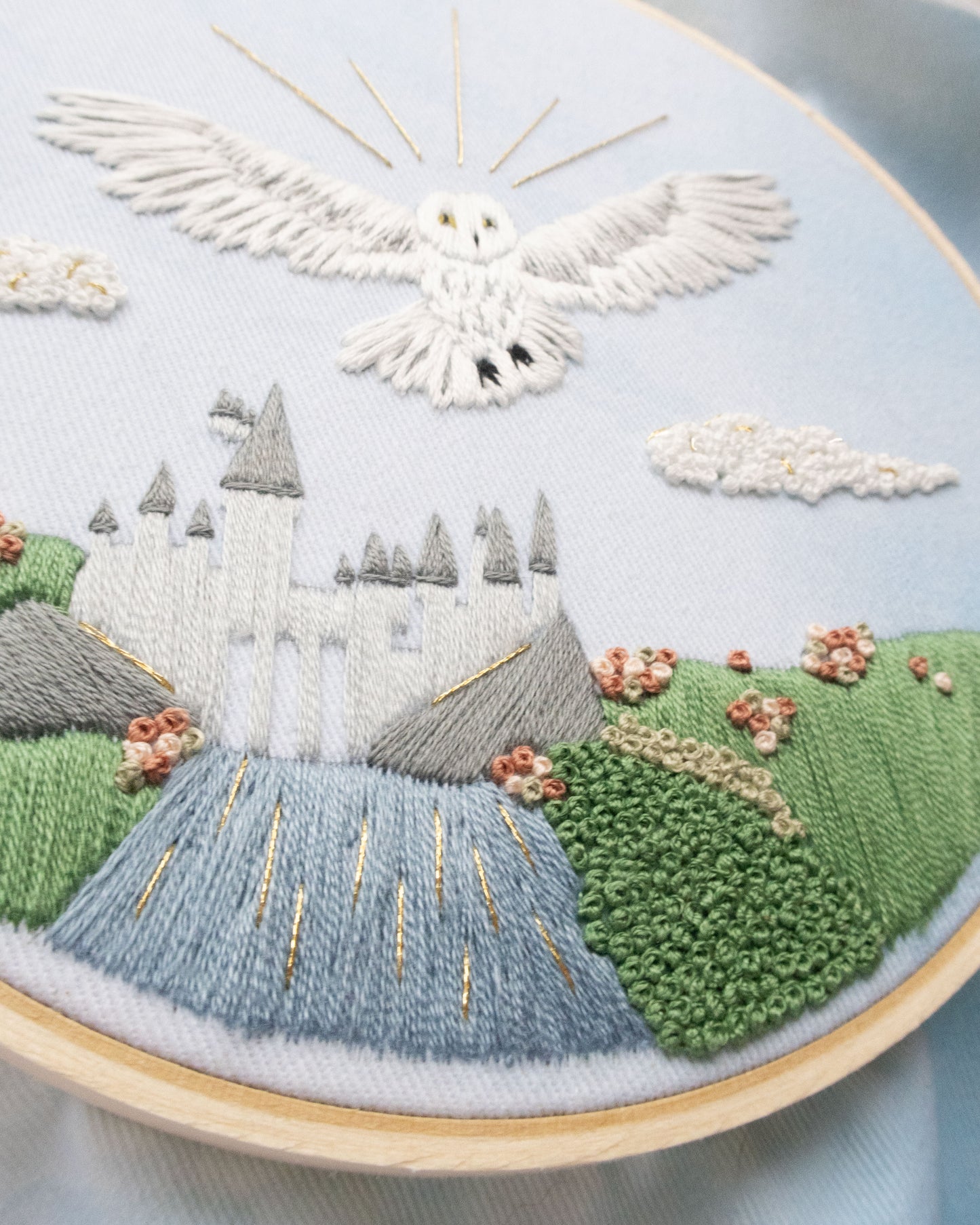 Spring Magical Owl Embroidery Kit close up details showing the green fields and castle and flowers and owl
