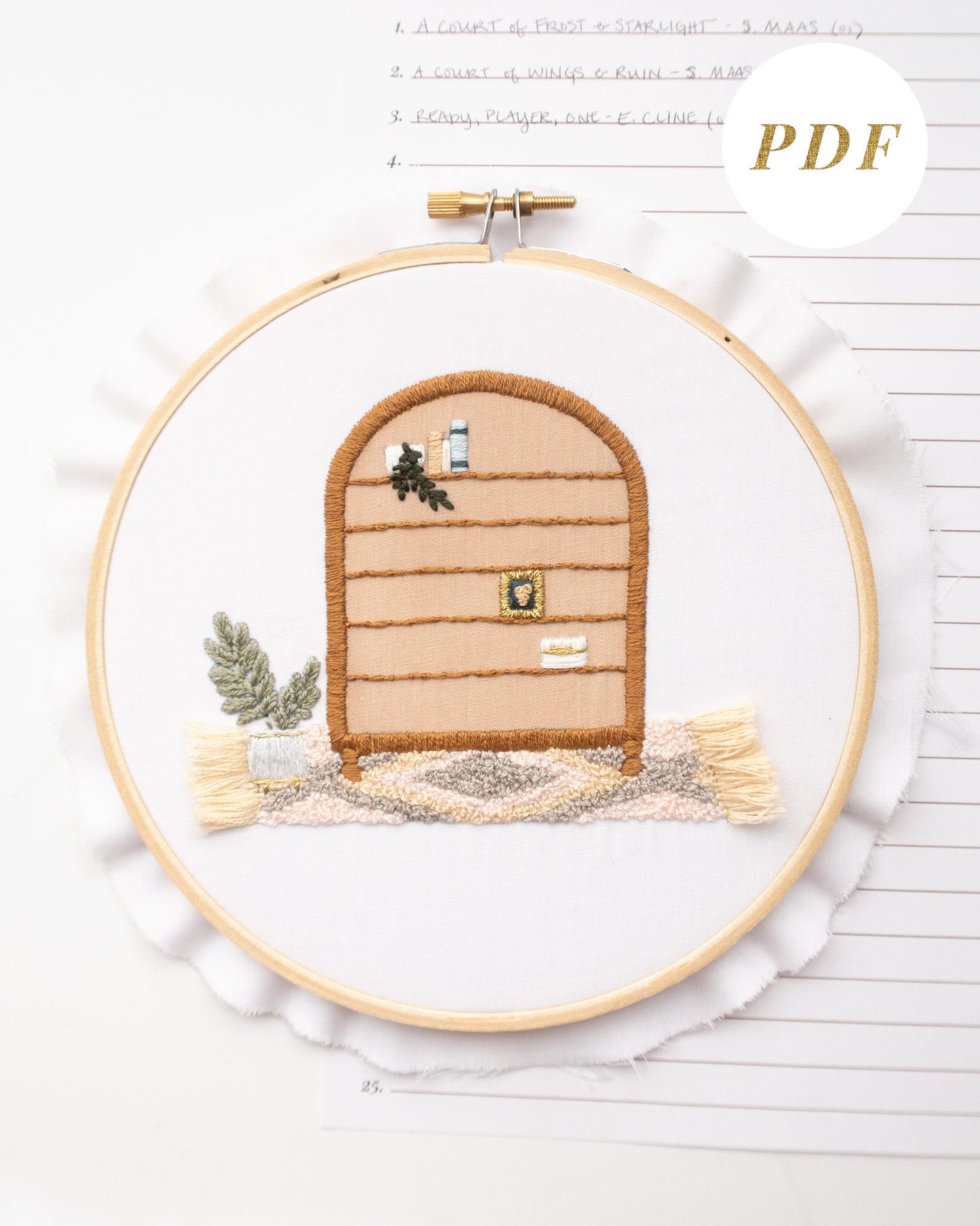 Free hand embroidery book tracker with bookshelf and boho rug with tassels and book rating sheet