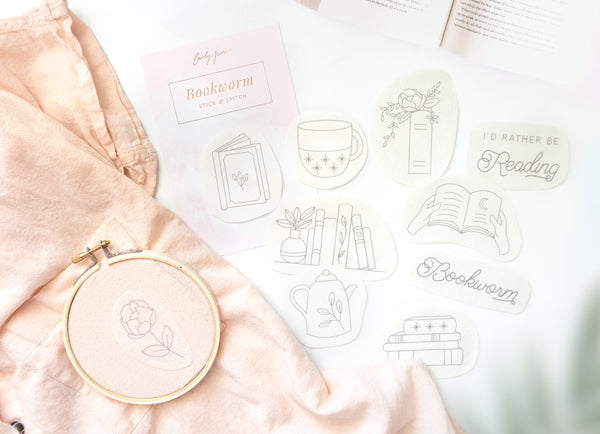 Book embroidery stick and stitch craft kit for clothing embroidery for bookworms and book loversBook embroidery stick and stitch craft kit for clothing embroidery for bookworms and book lovers with open book, floral tea pot, floral book, bookshelf with plants, open floral book, rose, and stacked books design and reading quotes