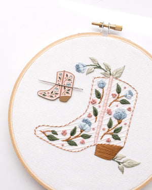 Floral pink enamel boot needle minder or needle nanny on floral cowboy boot hand embroidery needle minder on a finished boot embroidery kit