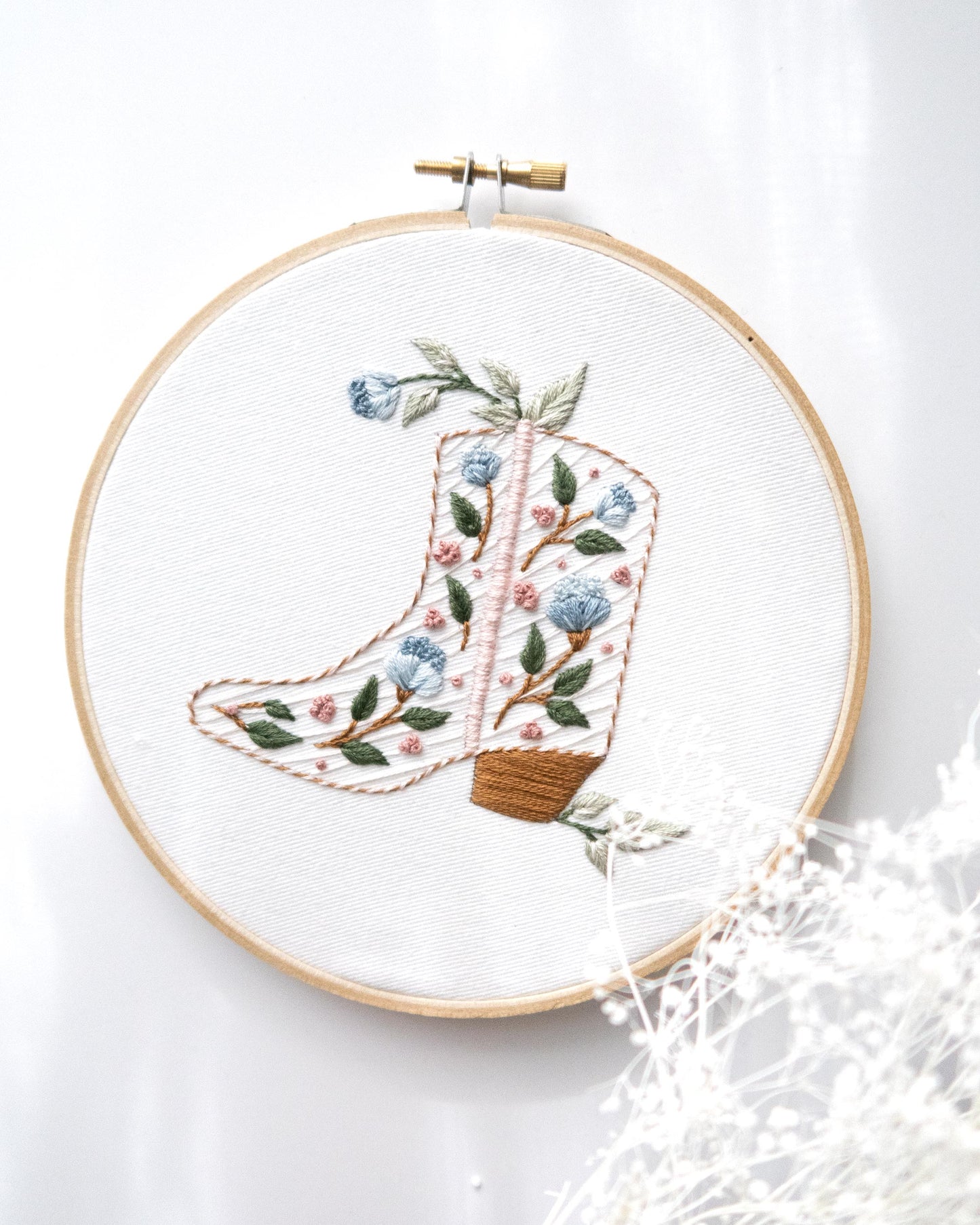 Floral cowboy boot hand embroidery kit with pink and blue flowers and light green leaves 