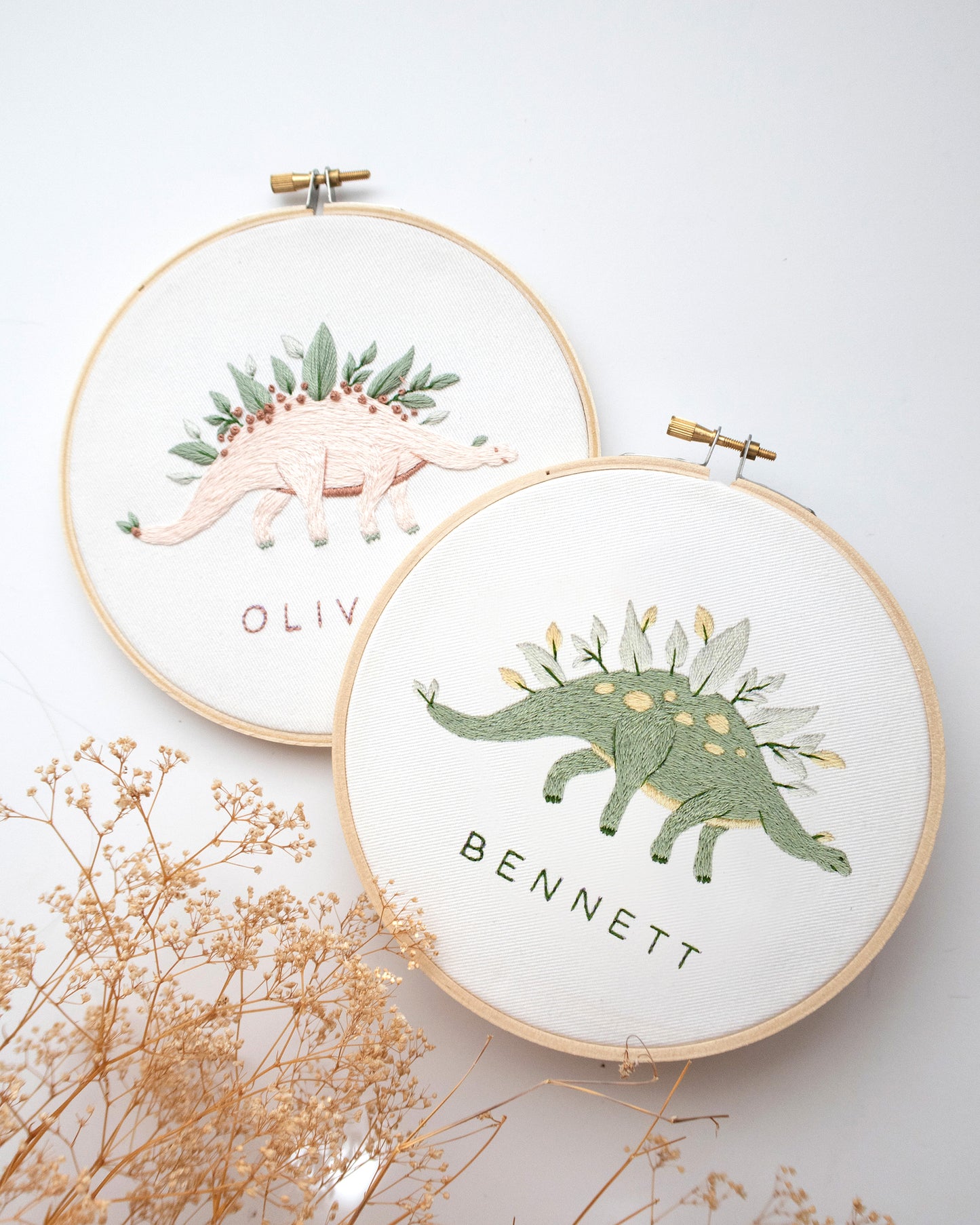 Green and pink dinosaur embroidery with leaves and flowers and custom baby name embroidery craft kit