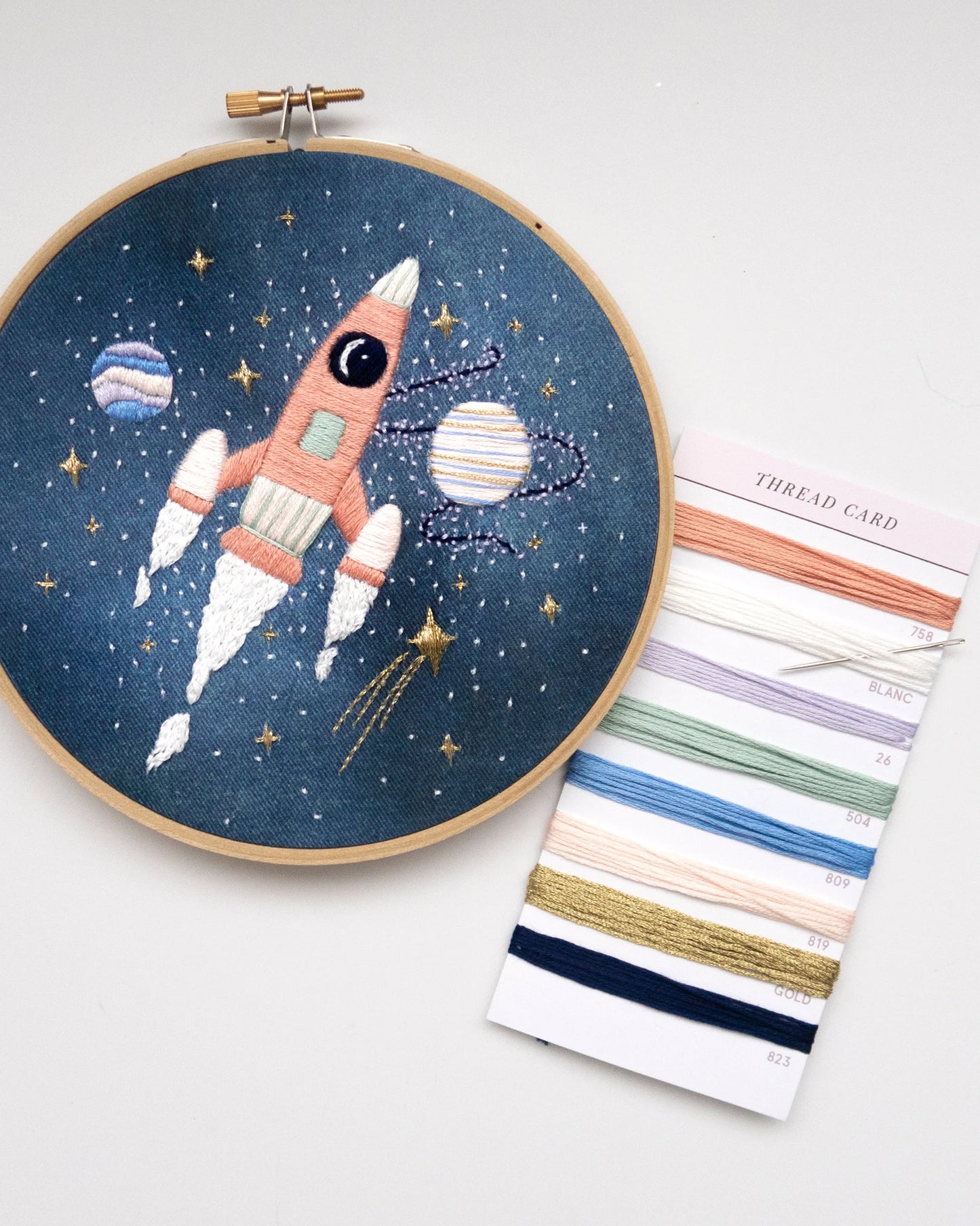 Pink rocket ship in outer space hand embroidery kit for outer space nursery or decor with planets and stars with embroidery floss card and embroidery needle