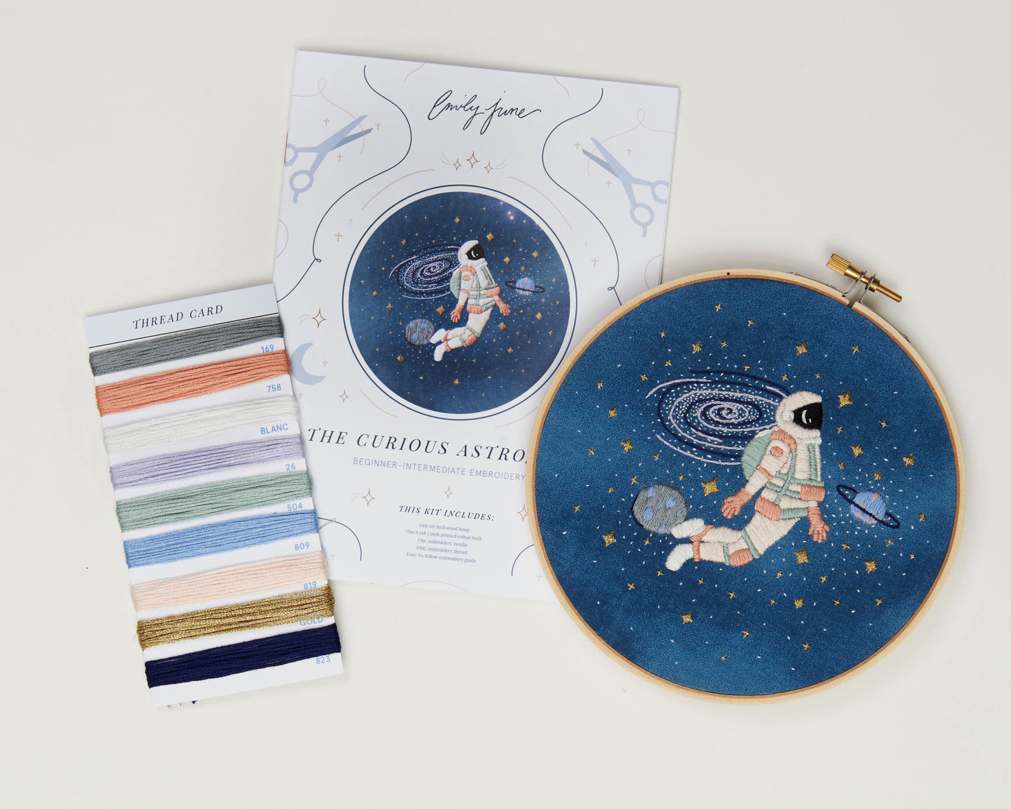 Blush astronaut in outer space hand embroidery kit for outer space nursery or decor with planets and stars with printed embroidery fabric, wood embroidery hoop, embroidery floss, embroidery needle and embroidery guide